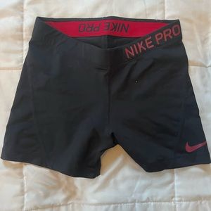 Nike Pro black spandex shorts with red accent